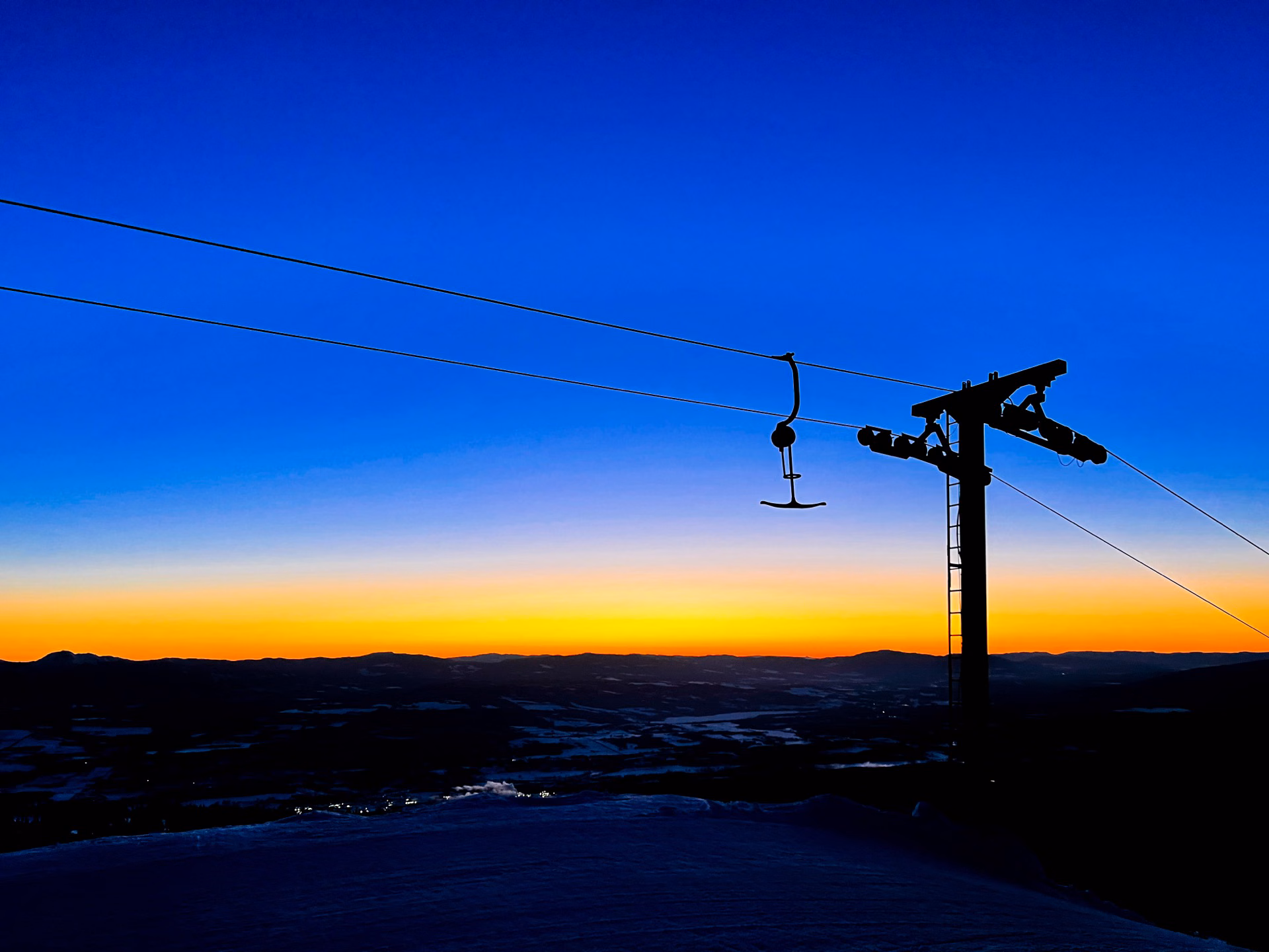 T-bar ski lift silhouetted at sunset on Hudson Bay Mountain